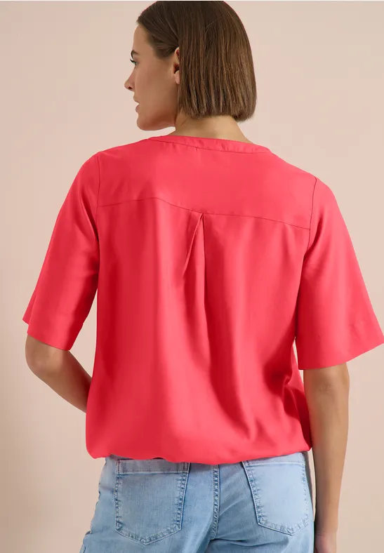 Blouse à manches courtes avec col fendu coral