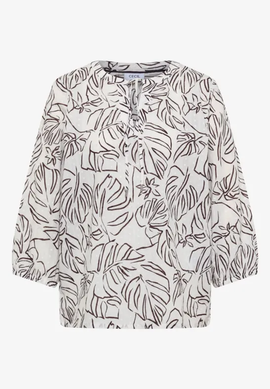 Blouse femme beige clair à motif de feuilles marron foncé, manches 3/4 et encolure ronde fendue.
