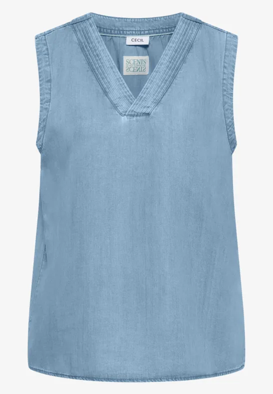 Haut sans manches en jean bleu clair avec décolleté en V.