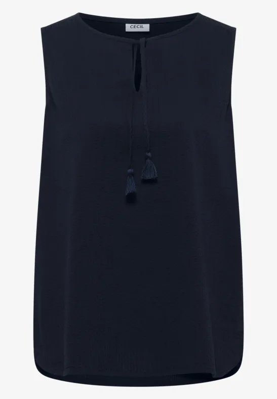 Top sans manches bleu marine avec encolure ronde et fente avant ornée de pompons.