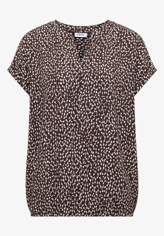 Braune Bluse mit V-Ausschnitt, kurzem Arm und cremefarbenem Tupfenmuster.