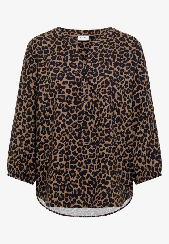 Blouse imprimé léopard, manches 3/4, col en V et coupe ample.