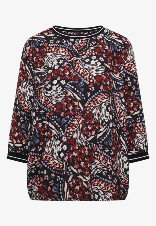 Blouse foncée à motif floral coloré et manches trois-quarts