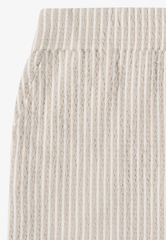 Jupe rayée blanc et beige, taille haute élastique, poche latérale.