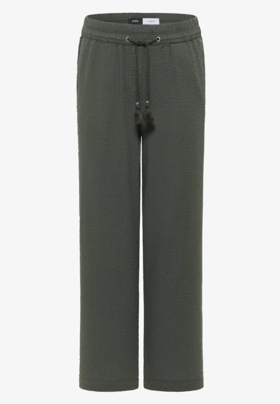 Dunkelgrüne, gerade geschnittene Hose mit elastischem Bund und Kordelzug mit Quasten.