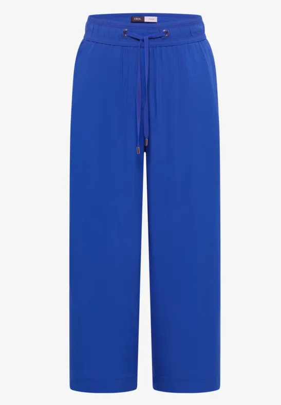 Weite blaue Damenhose mit hohem Bund und Kordelzug.