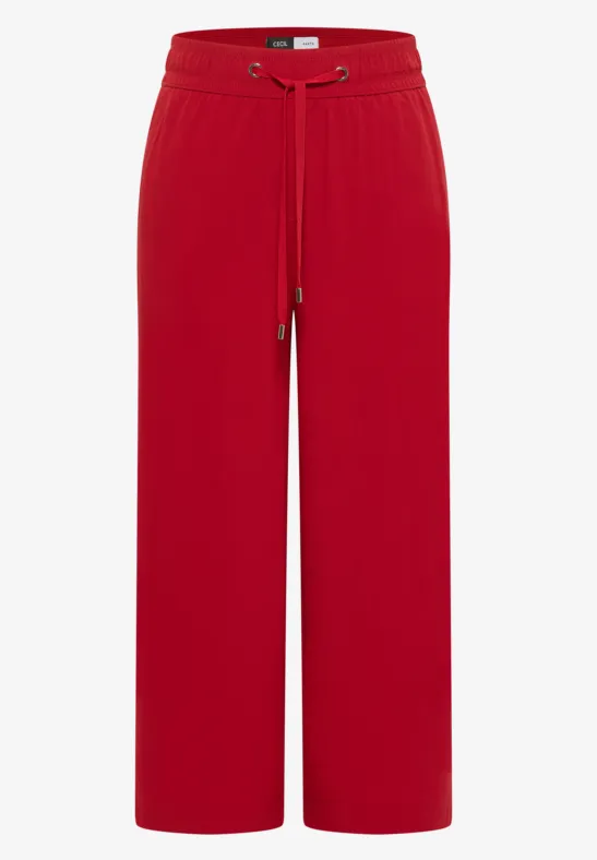 Rote, weite Hose mit elastischem Bund und Tunnelzug, locker geschnitten.