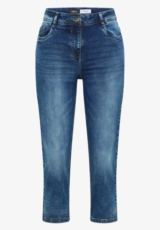 Damen-Jeans in mittlerer Blue-Waschung mit dezenter Used-Optik, knöchellang und figurbetont.