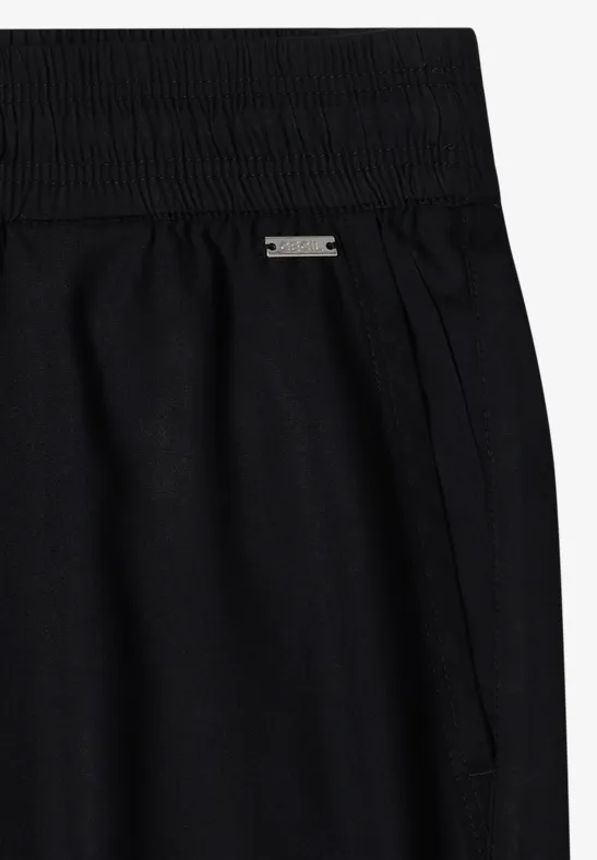 Pantalon noir taille haute avec ceinture élastique et poches latérales, en jersey doux.