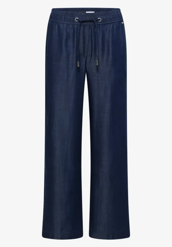 Pantalon en jean bleu foncé à coupe large, taille élastique avec cordon.