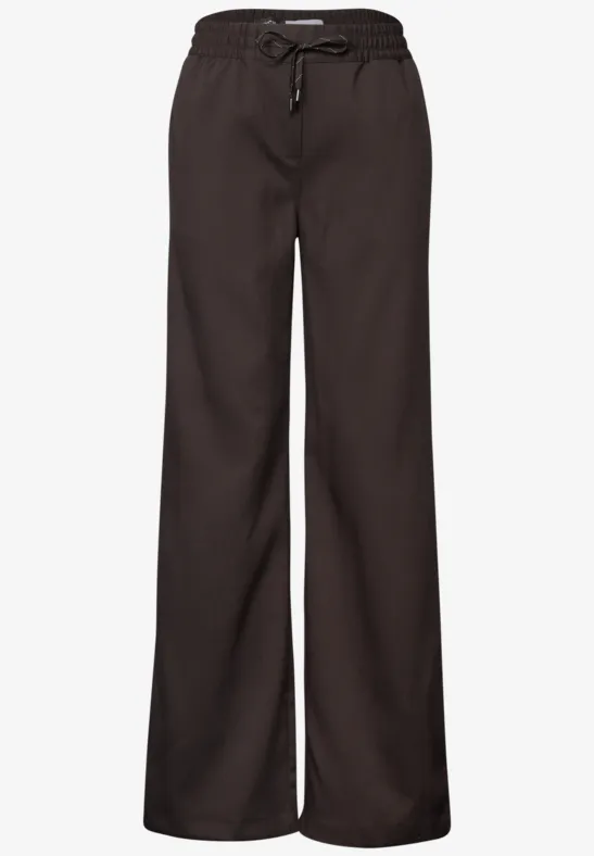 Pantalon lounge noir, coupe ample, taille élastique avec cordon.