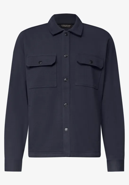 Surchemise bleu marine pour homme avec poches poitrine, patte de boutonnage, col classique et manches longues.