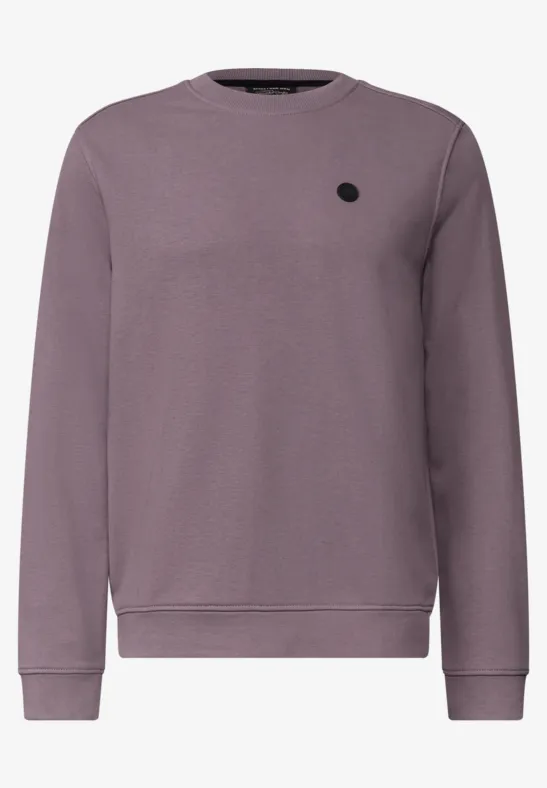 Lila Sweatshirt mit Rundhalsausschnitt, langen Ärmeln, Rippbündchen und kleinem schwarzem Logo-Patch auf der Brust.