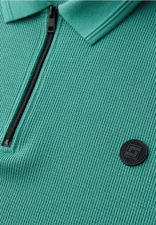 Polo zippé et structuré caribbean green