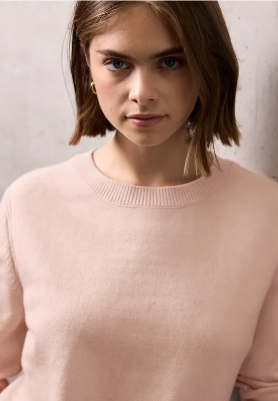Pull doux avec détails peachy blush mel.