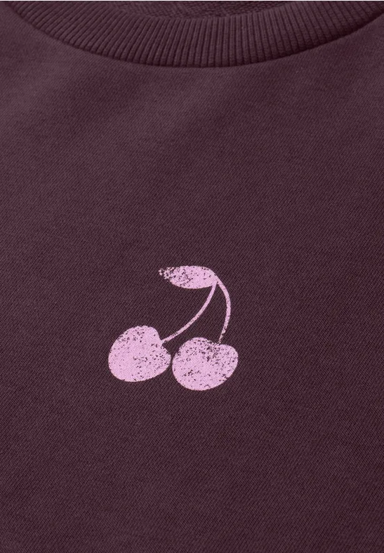 Ein dunkelviolettes T-Shirt mit einem rosa Kirschpaar.