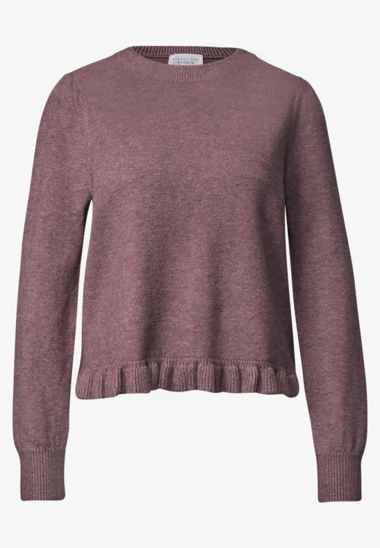 Rosa Feinstrickpullover mit Rüschensaum und Rundhalsausschnitt, langärmlig und leicht tailliert.
