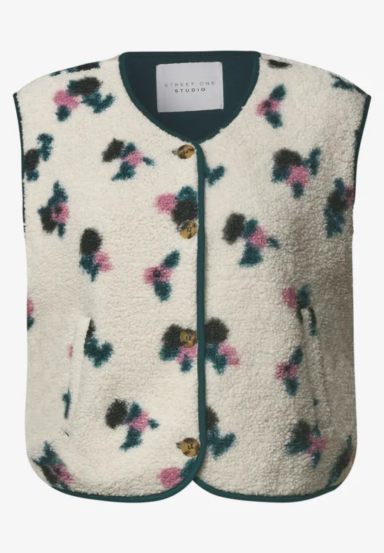 Veste sans manches en polaire sherpa, motif fleuri, encolure ronde et fermeture à boutons.