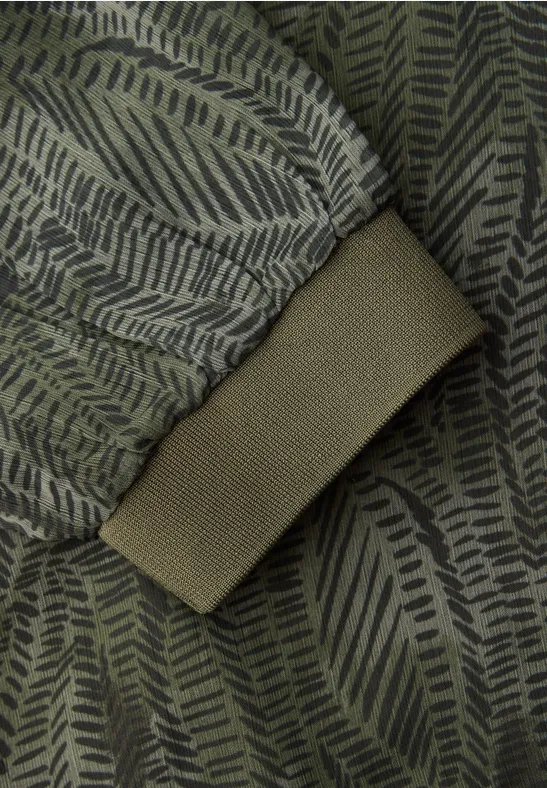 Blouse à manches longues avec col en V en mousseline de soie oil green