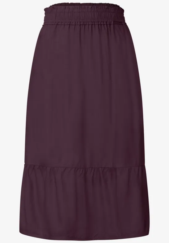 Donkerpaarse midirok met elastische taille en een wijde volant.