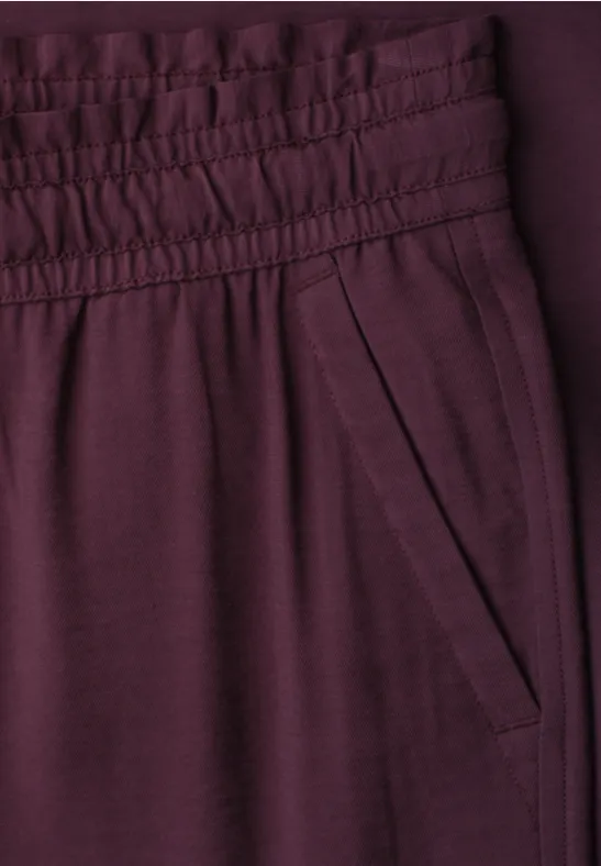 Paarse broek met elastische taille en zijzak