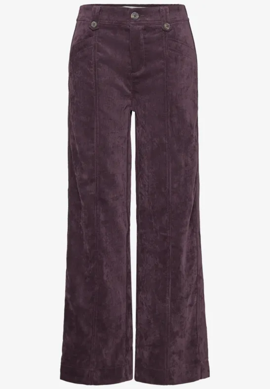 Pantalon taille haute en velours côtelé bordeaux, coupe large.