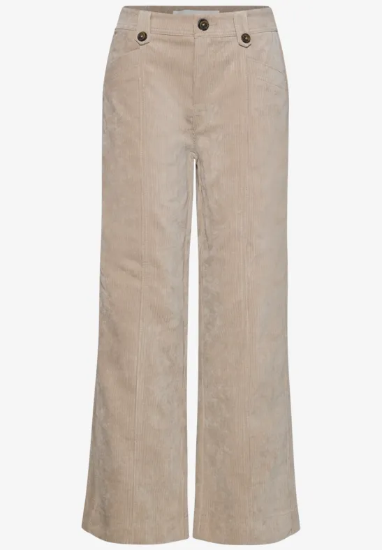 Pantalon en velours côtelé beige, coupe évasée et boutons à la taille.