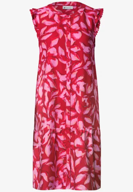 Robe midi sans manches rose à motif feuilles claires et coupe ample.