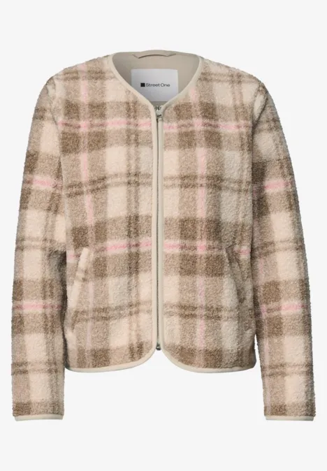 Beige kariertes Damenjacket mit Rundhalsausschnitt, Reißverschluss und aufgesetzten Taschen.