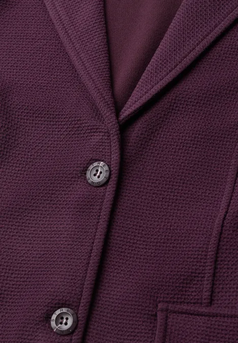 Purpurfarbener Blazer mit strukturierter Oberfläche, zwei Knöpfen und Taschen.