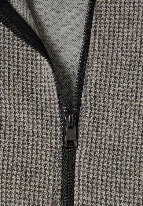 Veste à col chemise et à motifs Black Nahaufnahme eines Reißverschlusses auf grauem Hahnentrittmusterstoff
