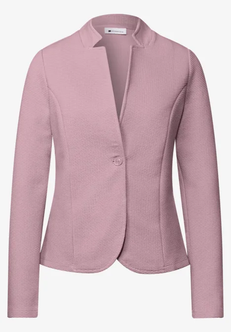 Hellrosa Blazerjacke für Damen mit langem Arm und Knopfverschluss.