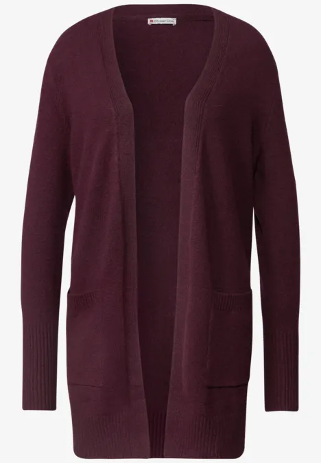 Cardigan en tricot bordeaux, ouvert, manches longues et poches plaquées.