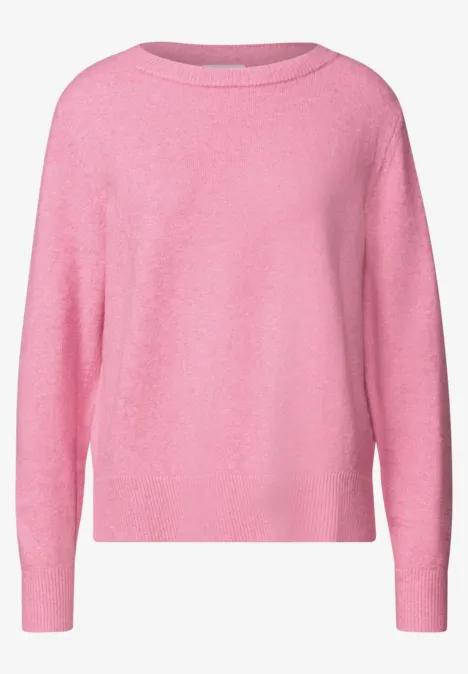 Ein rosa Pullover mit Rundhalsausschnitt und langen Ärmeln.