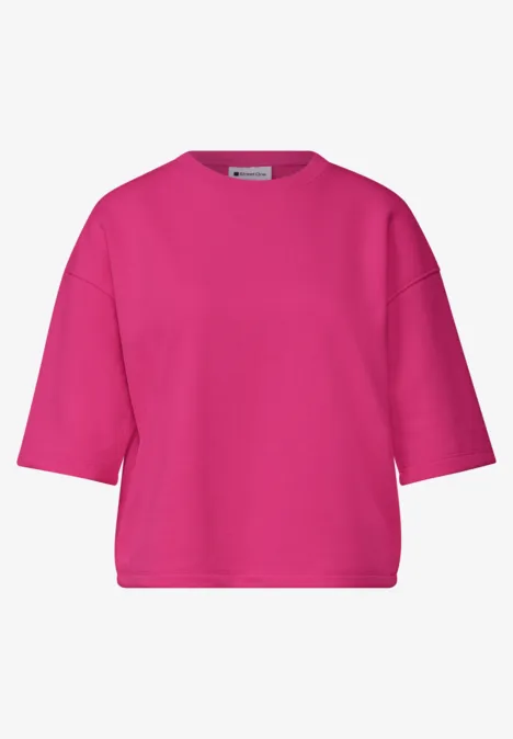 Fuksjowy, luźny t-shirt z krótkimi rękawami i okrągłym dekoltem.