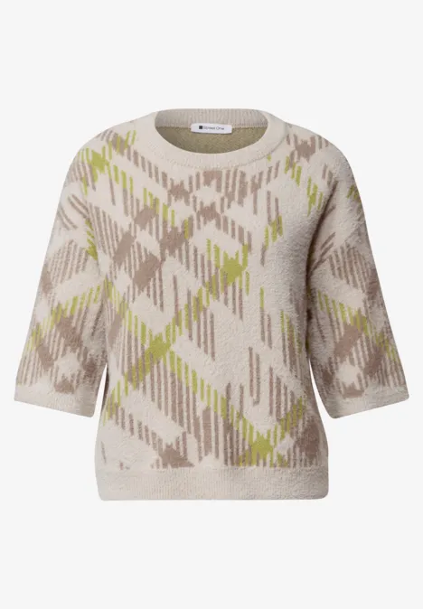 Beiger Kurzarm-Pullover mit Rundhalsausschnitt und abstraktem Argyle-Muster in Natur- und Lindgrün.