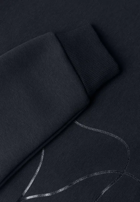 Sweatshirt met Loose Fit-pasvorm en folieprint indigo night Schwarzer Sweatshirt-Ärmel mit silbernem Linienmuster.