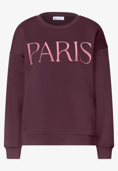 Sweat-shirt bordeaux avec inscription rose 'PARIS' sur la poitrine.