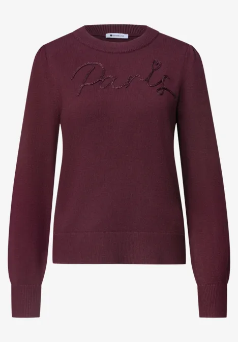 Pull bordeaux col rond avec inscription 'Paris' sur la poitrine.