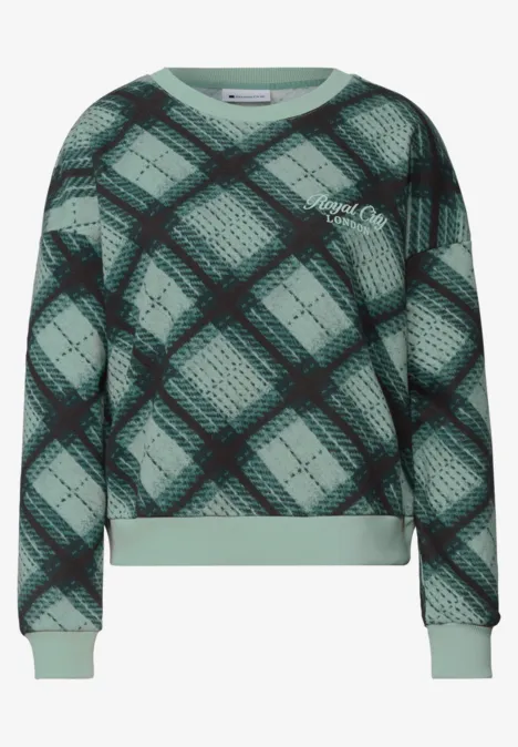 Sweat-shirt à col rond et motif à carreaux stormy green Sweat vert à carreaux noirs, manches longues et finitions côtelées.