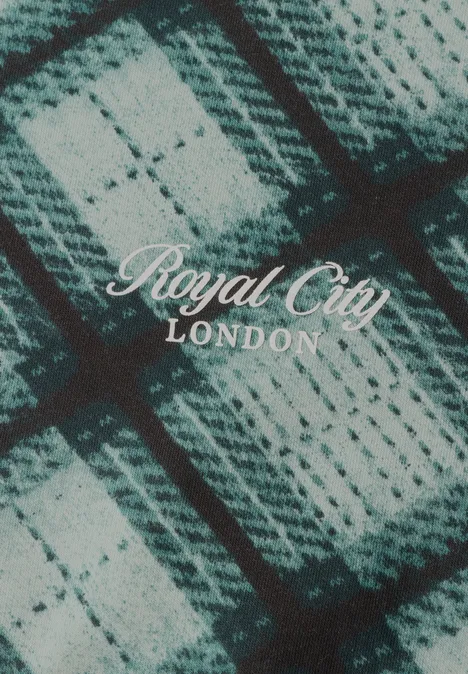 Sweat-shirt à col rond et motif à carreaux stormy green Motif à carreaux tricoté tons gris-bleu, surmonté du texte blanc 'Royal City LONDON'.