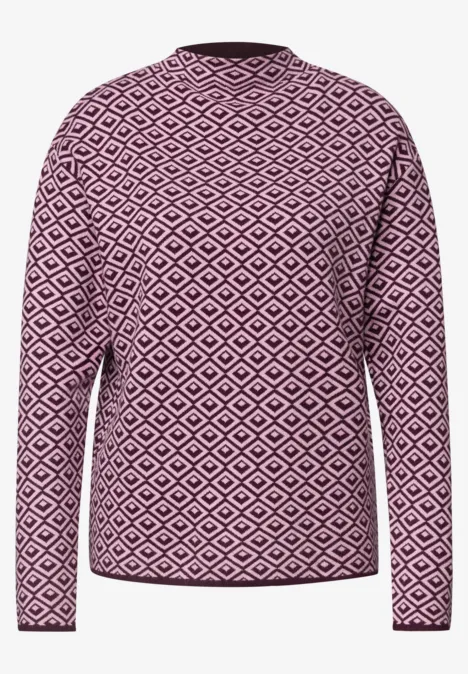 Damenpullover in Pink mit weißem Rautenmuster, lange Ärmel und Rundhalsausschnitt.