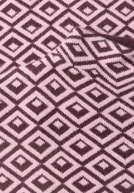 rosa Stoff mit schwarzen Rauten in geometrischem Muster