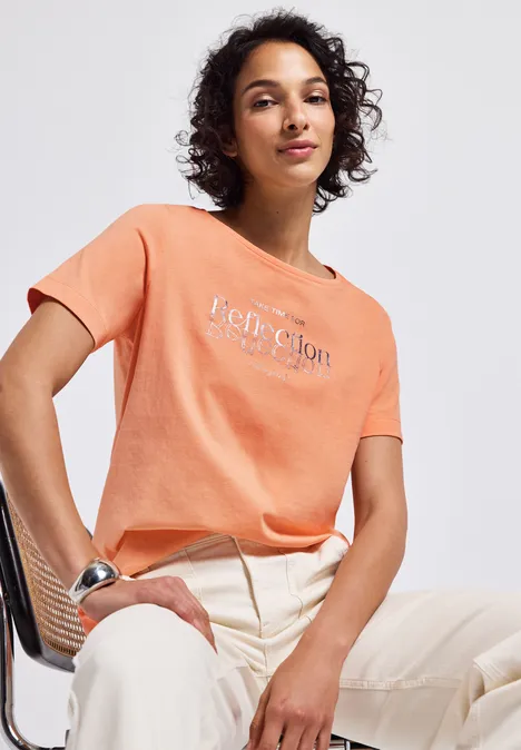 T-shirt avec un motif de film creamy orange