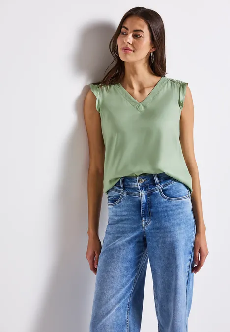 V-Neck Top mit Häkeldetails soft jade green