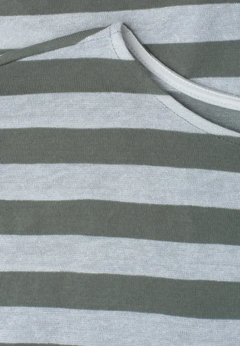 Shirt met hangende schouders, strepen en glitter bound green Close-up van grijs gestreept stof met een witte koord.