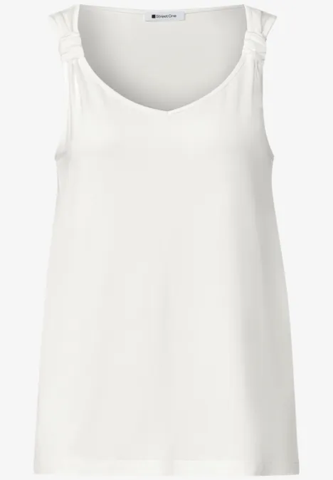 Weißes Tanktop mit U-Ausschnitt und gerüschten Trägern.