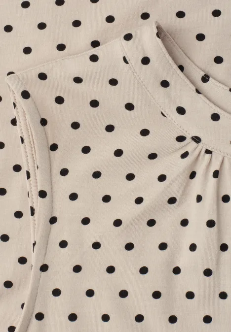 Beige Stoff mit schwarzen Punkten