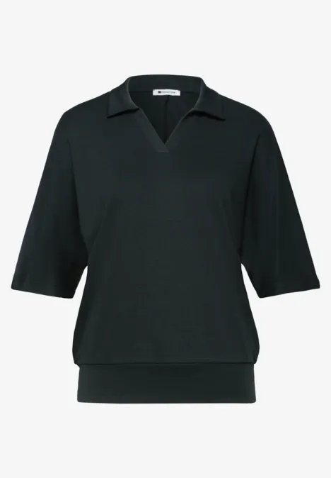 Poloshirt met elastische tailleband deep bound green Zwarte damespolo met V-hals, halflange mouwen en elastische boord.