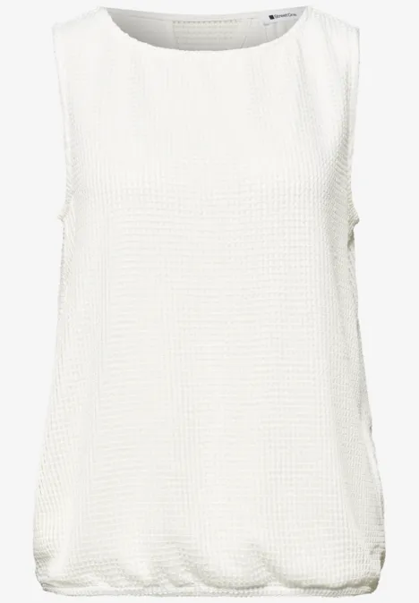 2-in-1 top van mesh met boothals off white Mouwloze witte top, losse pasvorm, ronde hals en subtiele textuur.